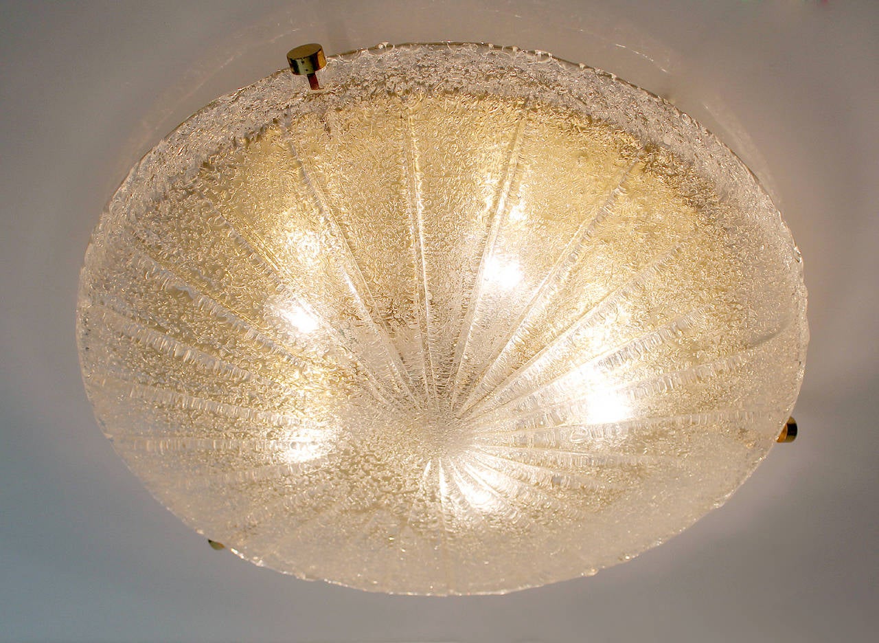 Large Hillebrand Flush Mount Light with impressed sunburst pattern in thick murano glass shade, polished brass base
3.15 in.H / 8 cmH
Diameter
19.68 in. (50 cm)
Five candelabra size bulbs, 40 watts each. professionally cleaned and rewired. 
