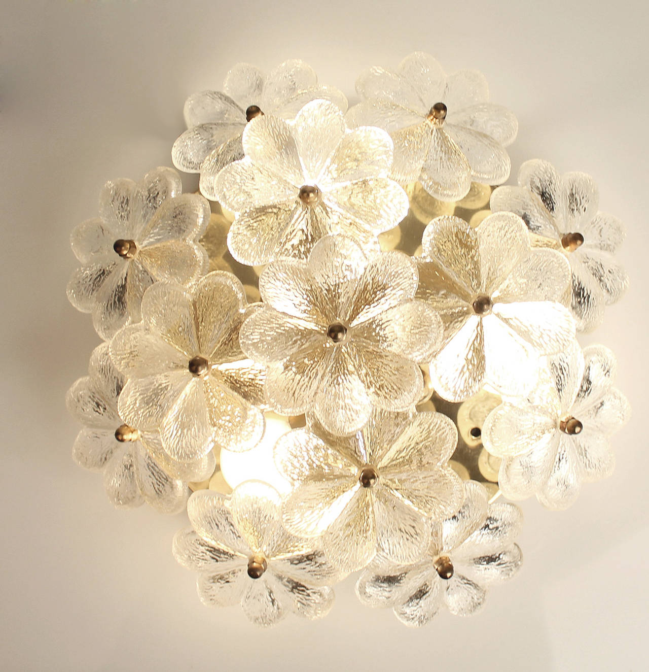 Murano Glass Sconce or flush mount light with glass flowers over a brass structure by Ernst Palme.

 3 candelabra size screw on bulbs up to 40 watts each