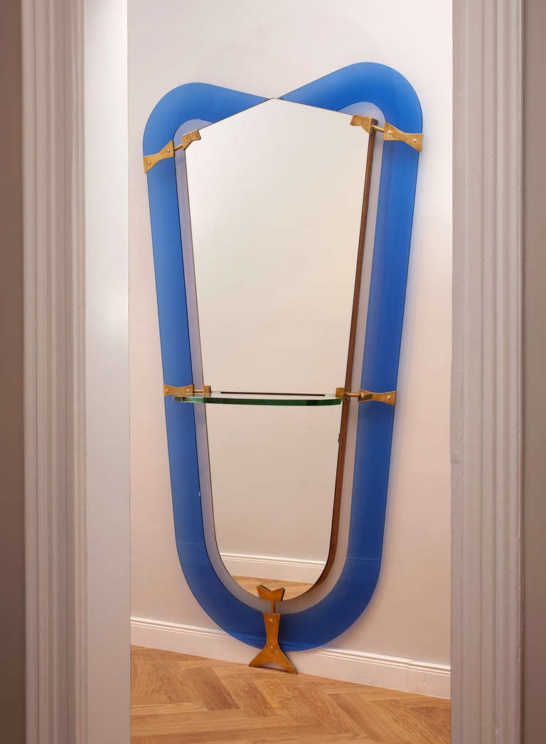 Amazing rare Cristal Art Floor Mirror, Italy circa 1950, rounded blue glasses, brass mounts, wooden frame, mirror glass, thick glass plate as a center console.
Height 200 cm, width 107 cm, depth 25 cm.