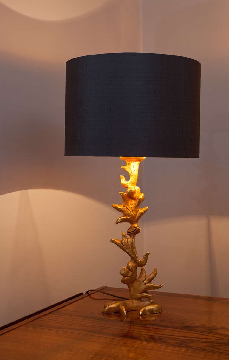 A sculptural gilt bronze table lamp by Mathias Prod. Fondica, France circa 1980, signed on the base Mathias, new elegant handmade grey Dupion silk, inside gold shade. 
Height with shade 69 cm
Height without shade 44 cm
Diameter of the shade 38