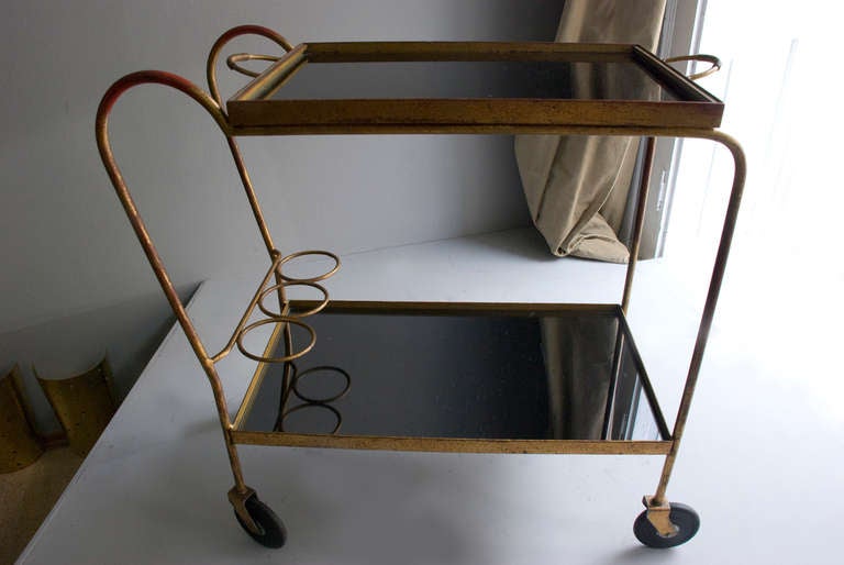Tea Trolley/ bar cartt attr. Jean Royère, France circa 1940, mirror glasses, removable tray, gilded metall frames, brass
bar cart
Literatur: Galerie Passebon, Paris and wright 20 auction house.