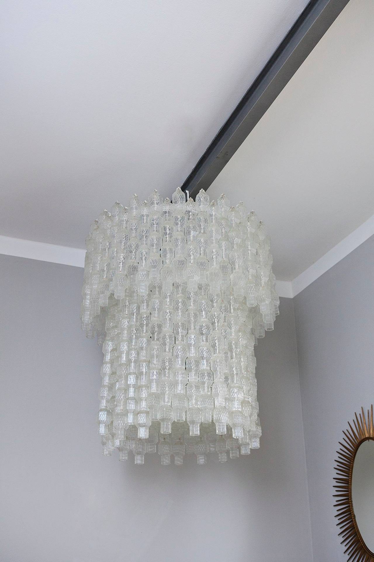 Very big wonderful shining chandelier by Archimede Seguso, Italy circa 1955, Prod. Seguso Murano, hundreds of Murano glass strands mounted on solid metal suspension, newly electrified.
All glasses are in a perfect condition.
Measures: Diameter 100