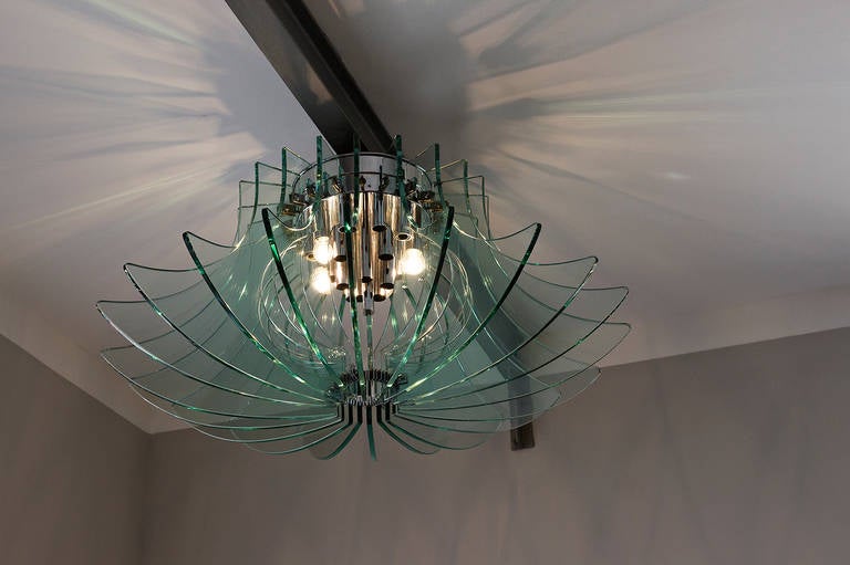 Very big and rare Fontana Arte, chandelier, Prod. Fontana Arte, circa 1960, Italy, glass and brass chromed suspension. 

Dimension: Diameter 110 cm, height 60 cm.

Literature or Bibliography: Fontana Arte catalog, 1968.