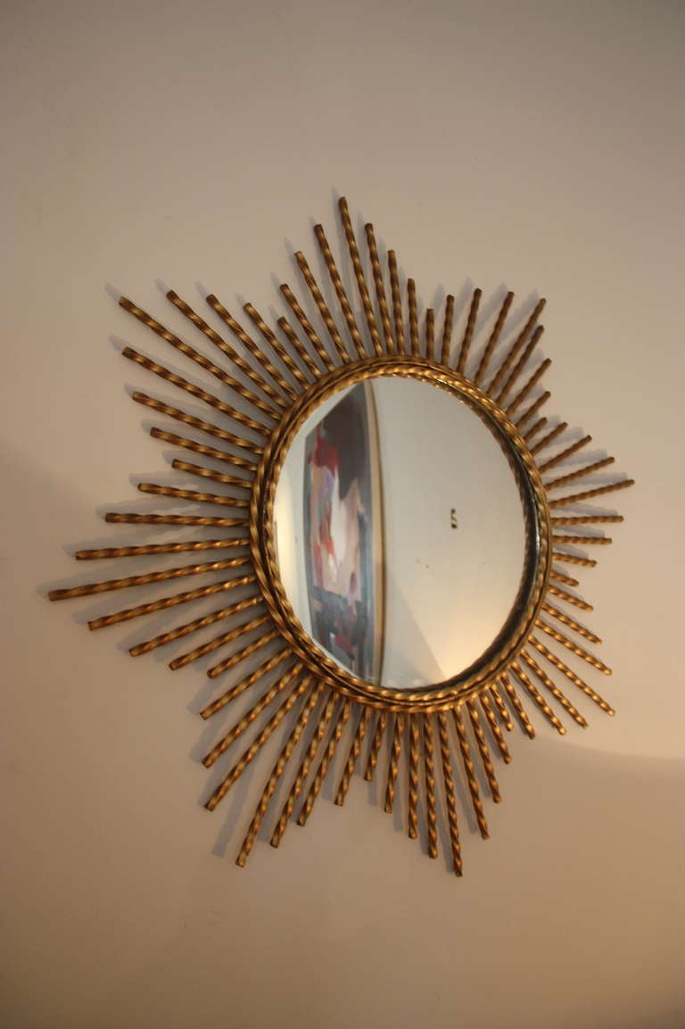 Sunbrust  Mirror wall, assemble with five brass mirrors in different designs. All from France, circa 1950. Price for all mirrors together!
Dimensions:
1. 90 cm Diameter
2. 60 cm Diameter
3. 50 cm Diameter
4. 50 cm Diameter
5. 50 cm Diameter