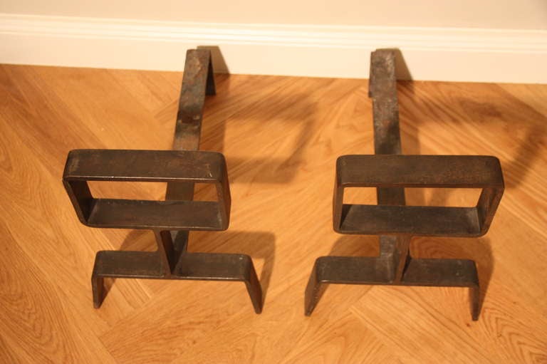 very nice pair of heavy iron andirons in the manner of Jean Royère, France circa 1950. Perfect patina on hand made iron.