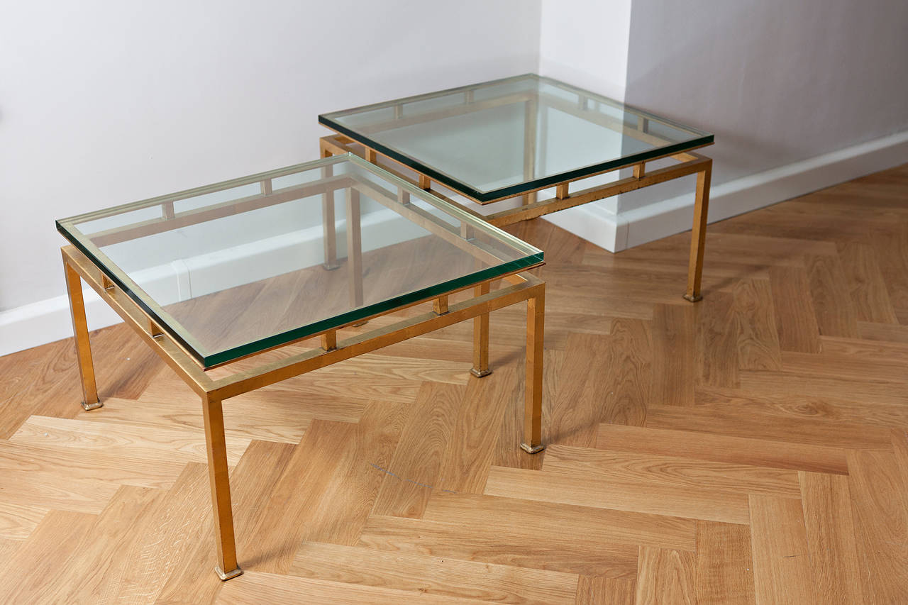 Pair of side table, France, circa 1960, rectangular brass, gilded and thick clear glass.
Measures: Height 43.5 cm, 70 cm x 70 cm.