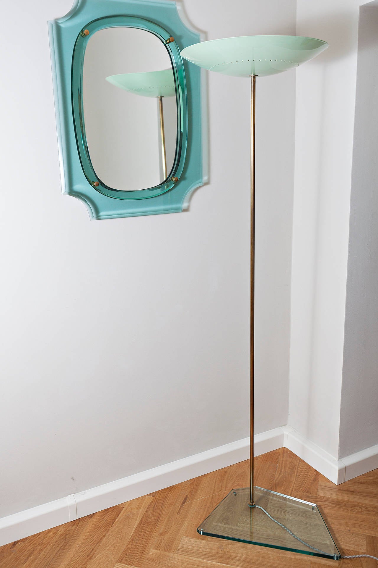 Rare floor Italian floor lamp torchiere Attributed to Stilnovo, Italy, circa 1955,
original lacquered turquoise metal screen
brass rod, thick glass base, five ceiling Spotlights
Dimensions: height 183 cm, base 30 x 38 x 55 cm, diameter of the