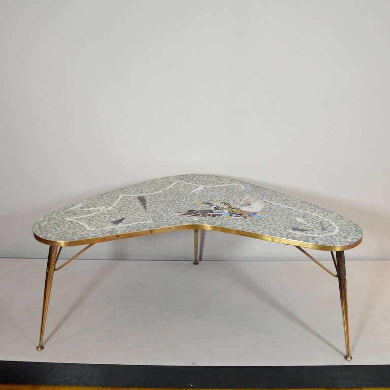 Lovely Mid Century Boomerang Mosaic Table made in Germany. 
Two flying ducks on table top.
Designed and produced probably in the 1950ies.