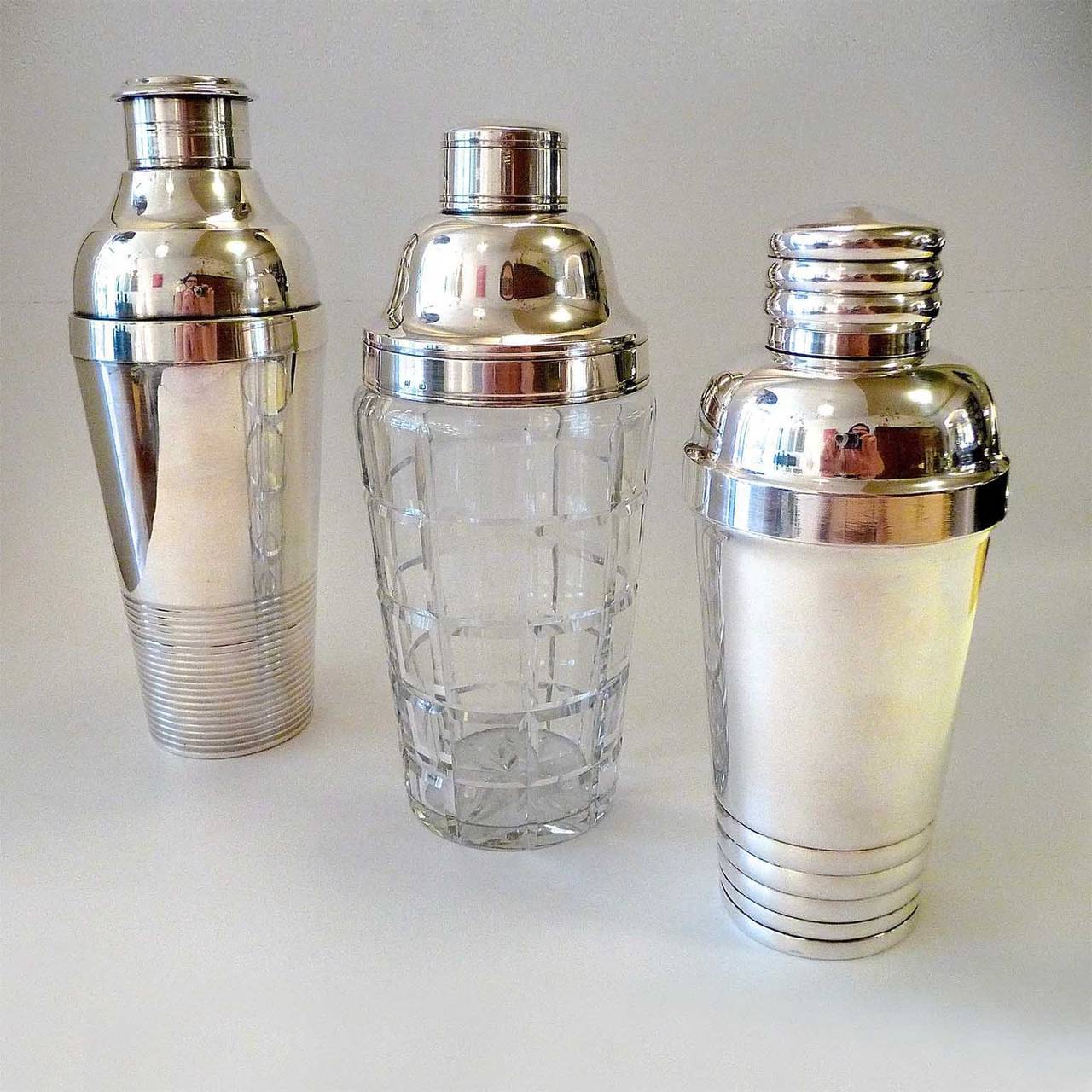 A wonderful selection of three Art Deco cocktail shakers:
Christofle, Saglier Freres, Udner (from left to right).

Christofle Gallia cocktail Shaker:
Luc Lanel design
Silver plated metal.
Marked 