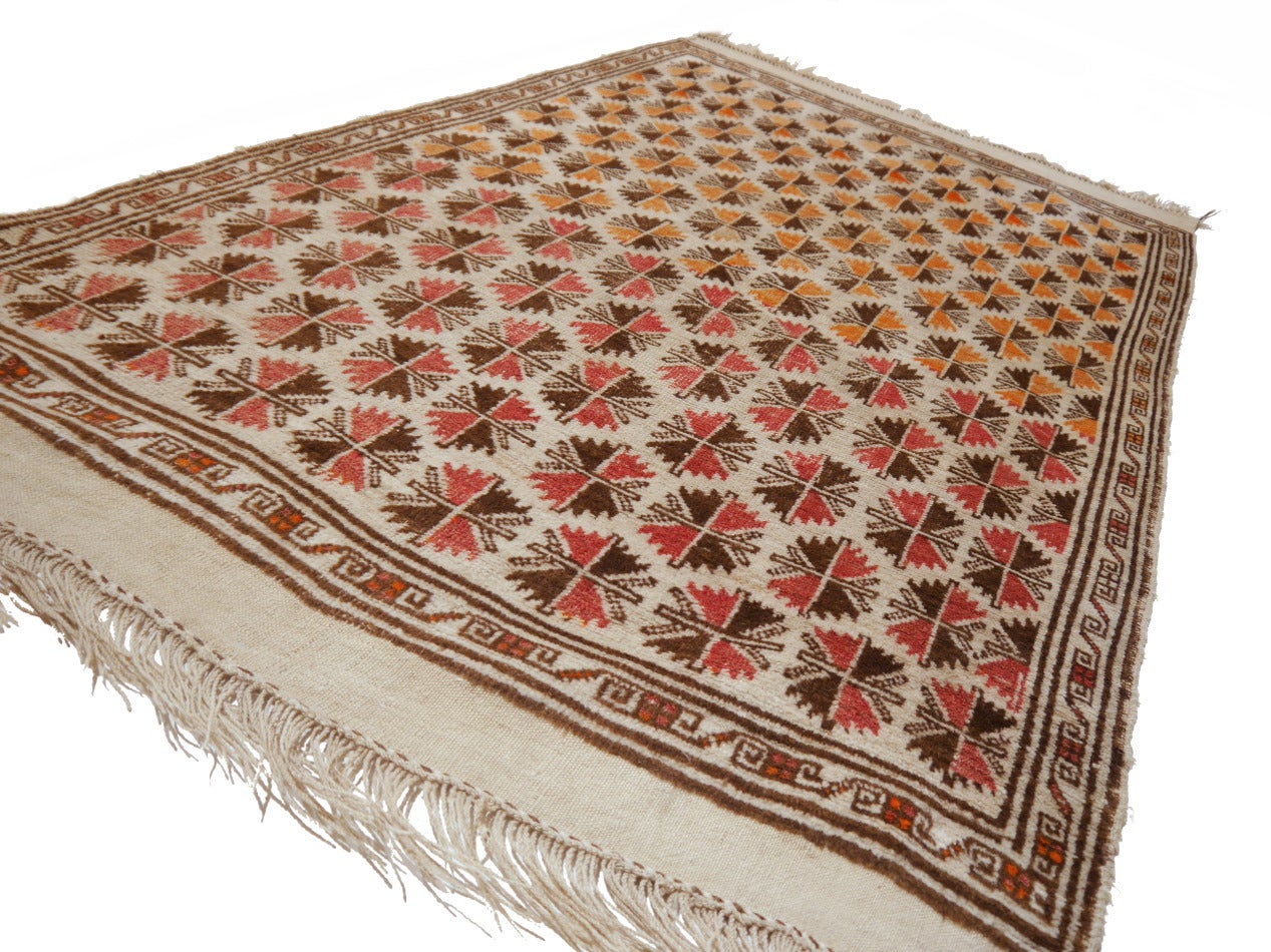 Beautiful tribal Afghan Taimani rug. Made 3rd Quarter 20th Century. These rugs are usually very colorfull with orange, blue or red field. This exceptional piece was made using undyed wool in beige and brown with orange and red elements. The colors