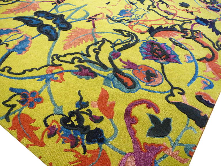 This new tibetan wool and silk rug was inspired by antique Agra rugs. The new Interpretation of an ancient design in fashionable colors gave birth to a stylish object of art. We can produce this rug customized to fit in sizes up to 24 x 18 ft in 300