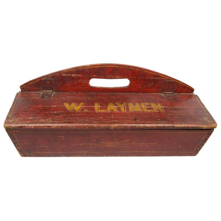 Bold red painted covered carpenters tool box belonging to 