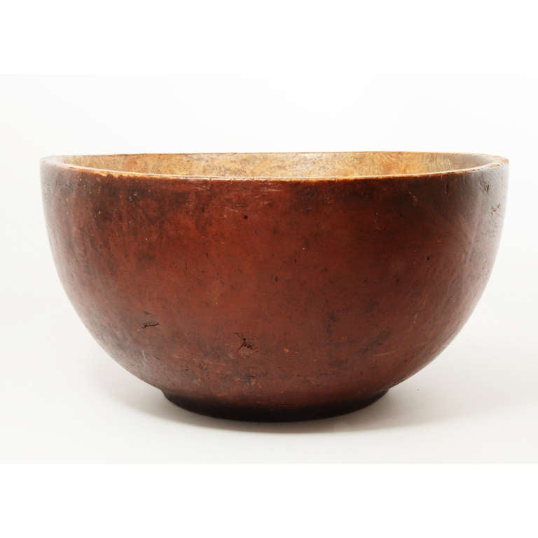 Dramatic and deeply proportioned red painted ash burl bowl. Gutsy! Its boldness is defined by its graceful body and economic rim treatment. This is one of my all time favorite objects (I have owned it twice).