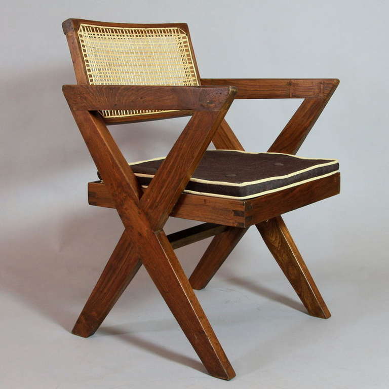 Arm Chair in solid teak and braided canework from the College of Architecture, Chandigarh, France/ India c. 1958.

Cane work seat and 'X' type double leg designed by Pierre Jeanneret.

Photo ref.: Similar model in 