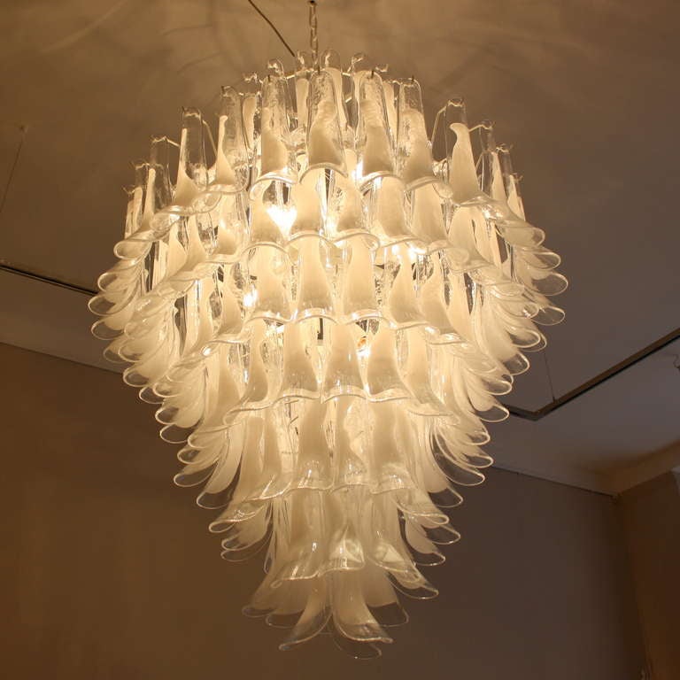Large Murano 8-tier glass chandelier with well over 140 pieces of 'horse shoe' glass with white coloration. White steel frame construction, Italy.