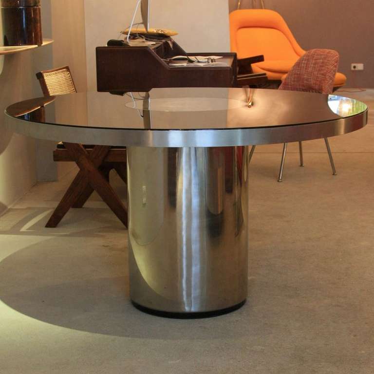 Dining Table in brushed metal and dark glass designed by Willy Rizzo, Italy 1970's.

Round table with metal covered base and thick glass covered top. AMAZING!