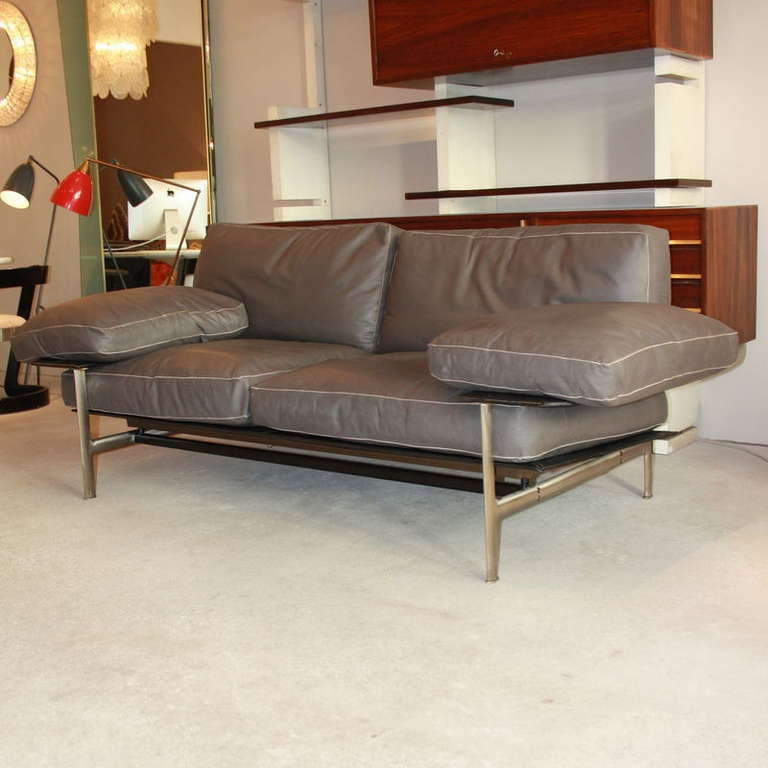 DIESIS Sofa, designed by Antonio Citterio and Paolo Nava in 1979 and manufactured by B&B  ITALIA. From the early series, brushed metal structure and fine, subtle grey leather cushions.
