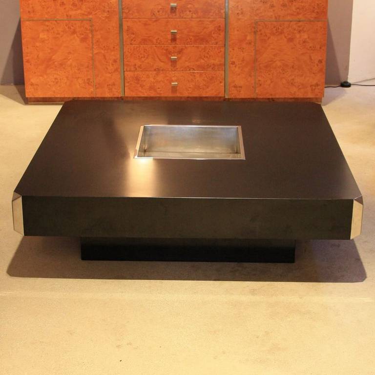 Large square black laminate coffee table in the style of Willy Rizzo, produced by Mario Sabot, Italy 1972. With metal centre storage insert.