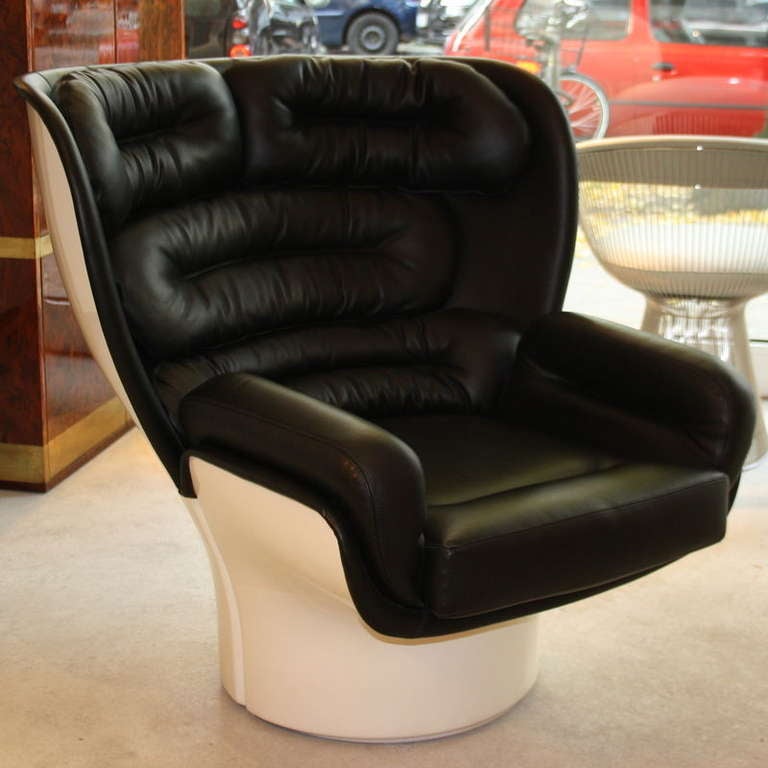 The ELDA Chair by Joe Colombo... deep shell shaped white body with moulded cushions in original black leather on a 360 degrees revolving base. Designed in 1965, Italy.

Reference: Habegger & Osman, Sourcebook of Modern Furniture, p422.;