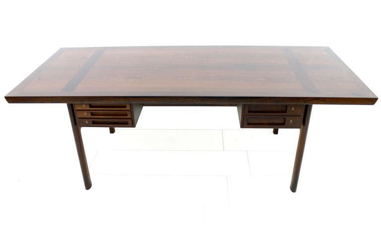 Very Rare Peter Hvidt & Orla Molgaard Nielsen Rosewood Desk / Table for Ludvig Pontoppidan, 1959, Denmark.
A Danish High Class Furniture with Fantastic Details. Rotating Drawers can make this Desk to a Dining or Conference Table. 

Excellent