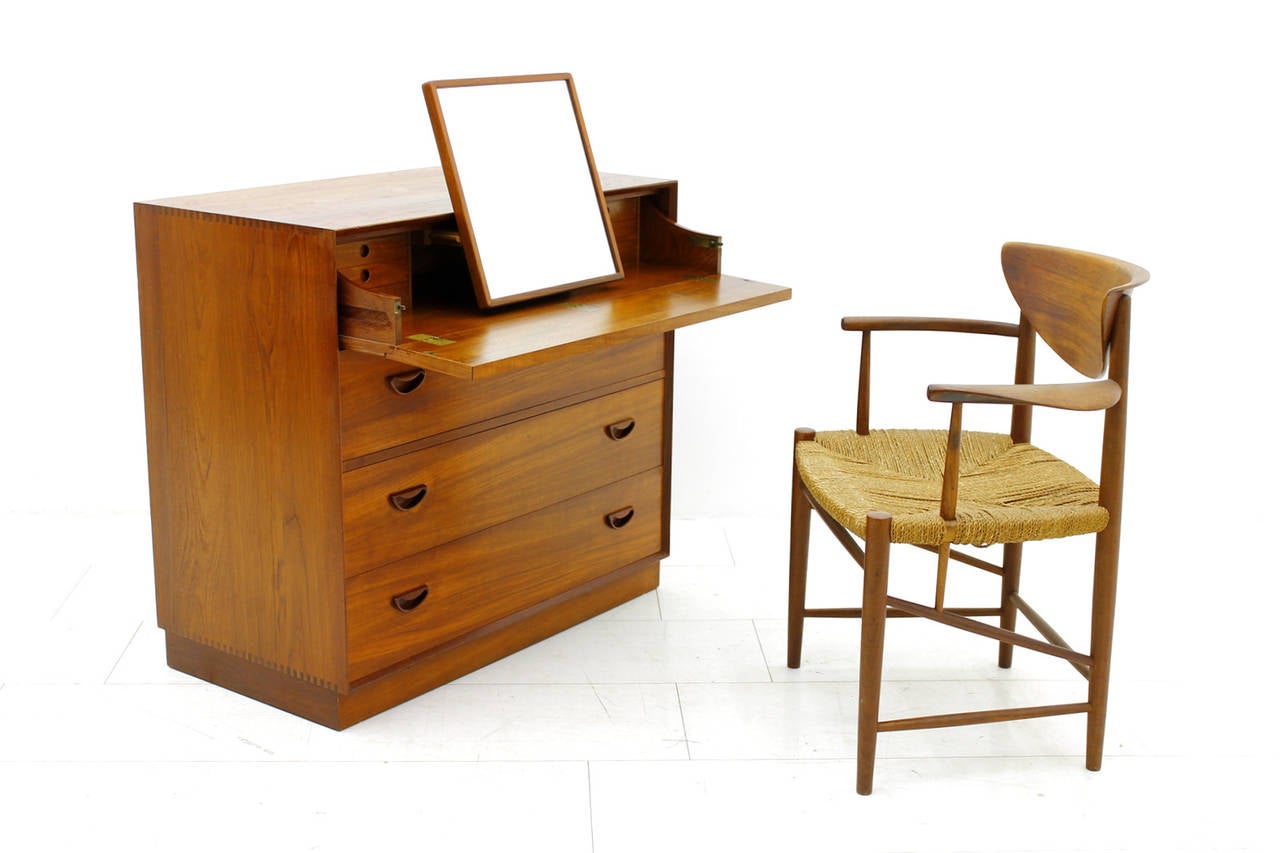 Rare dresser or vanity by Peter Hvidt & Orla Molgaard Nielsen, teakwood and brass, Denmark, circa 1950s.
Three large drawers, one-drawer with mirror and six more small drawers inside.
Very good original condition.
Dimensions: W 90 cm, H 94 cm, D