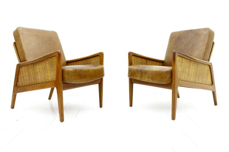 Very Early Pair Peter Hvidt & Orla Molgaard Lounge Chairs FD 151 with original cognac brown Leather Cushions, France & Daverkosen, Denmark, late 50`s.
Great Patina, great original Condition, great Chairs!