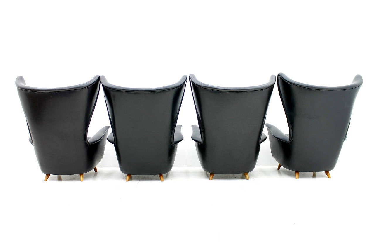 Foam Four Black Leather Wing Lounge Chairs, 1950s For Sale