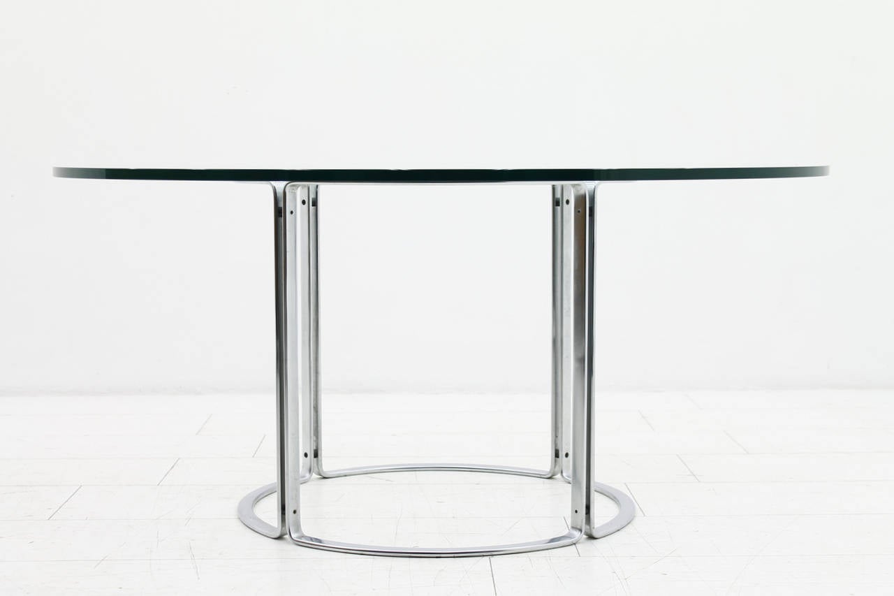 Large dining table glass top and steel base. Designed Horst Brüning, Germany for Kill International, 1970s.
Measures: Diameter 150 cm, high 71 cm.
Very good condition!

Worldwide shipping.