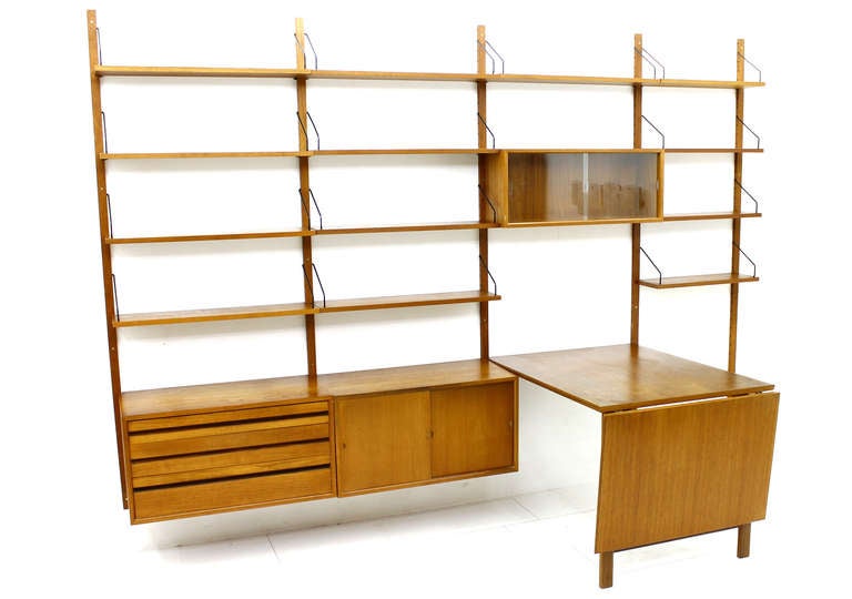 A Large Poul Cadovius Royal Wall System with a rare Drop Leaf Dining Table in Teak Wood. Denmark, 1960s.