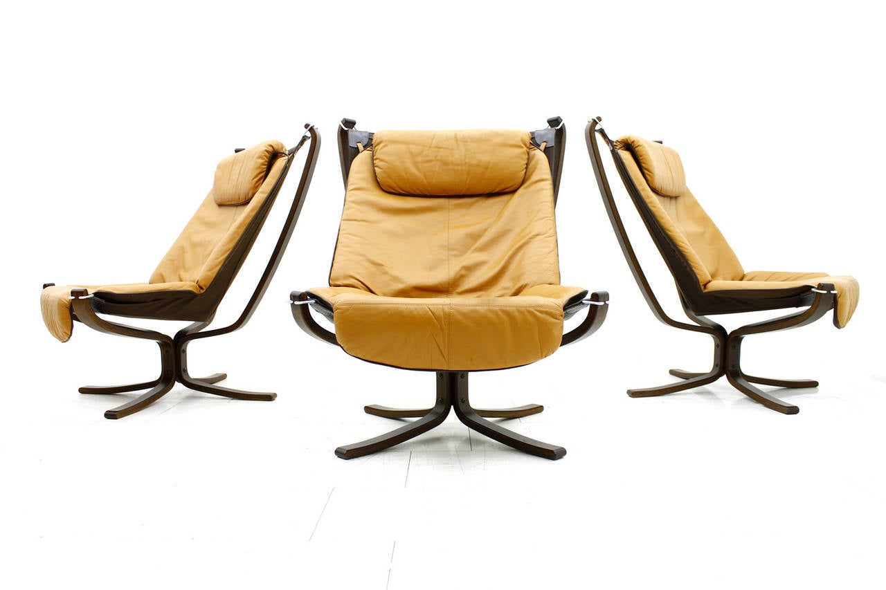 High back lounge chairs by Sigurd Resell for Vatne Mobler, Norway, 1971. Cognac brown leather, canvas and plywood. 
Excellent original condition.

Worldwide shipping.