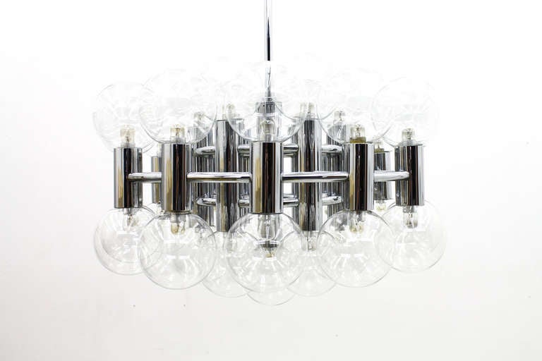 Large chandelier by Motoko Ishii made by Staff, Germany, 1971.
37 lamps, chrome an glass.
Excellent original condition.

