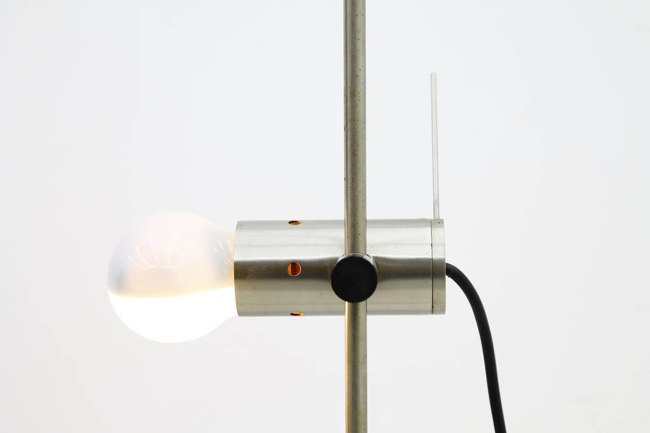 Floor lamp 387 by Tito Agnoli for O-Luce, 1955. This lamp is from 1960s. The condition is very good.

Measurements: H 192 cm, diameter 17 cm.

Worldwide shipping.