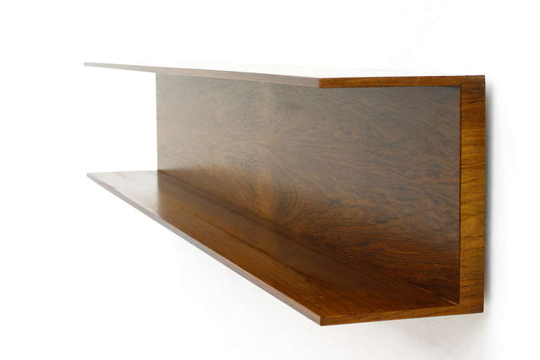 Large Rosewood Wall Shelf by Walter Wirz for Wilhelm Renz, Germany ca 1960`s.

Wide 150 cm, Height 26 cm, Depth 20 cm.

Express shipping is worldwide possible. Please ask us.