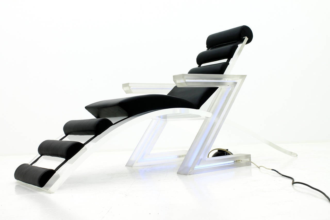 Spectacular illuminated lounge chair in Lucite, from an exclusive club in St. Moritz, Switzerland, circa 1970s. Illuminated armrests in a 