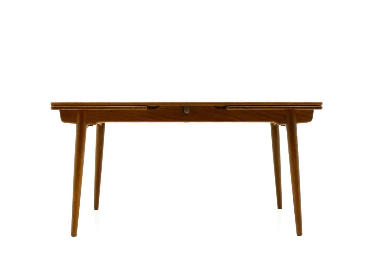 Large Teak Wood Dining Table by Hans J. Wegner AT-312 with two extensions by Andreas Tuck, Denmark

Maximum Wide 240 cm.

Very good Condition.

We offer a worldwide shipping. Please contact us for a transport offer for a delivery to your door