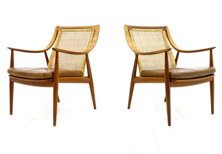 Early Pair Hvidt & Molgaard Lounge Chairs Teak & Cane 1956, FD 156. Produced from France & Daverkosen, Denmark.
Teak Wood, Cane and original Cognac colored Leather.

Very good original Condition.