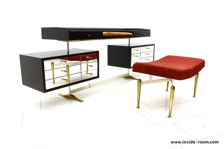 Beautiful Dressing Desk or small writing Desk with footstool. Unknown designer and manufacturer. Mirror fronts and Glass Top with mirror, brass base and grips.
Fully professional restored. 

Excellent Condition