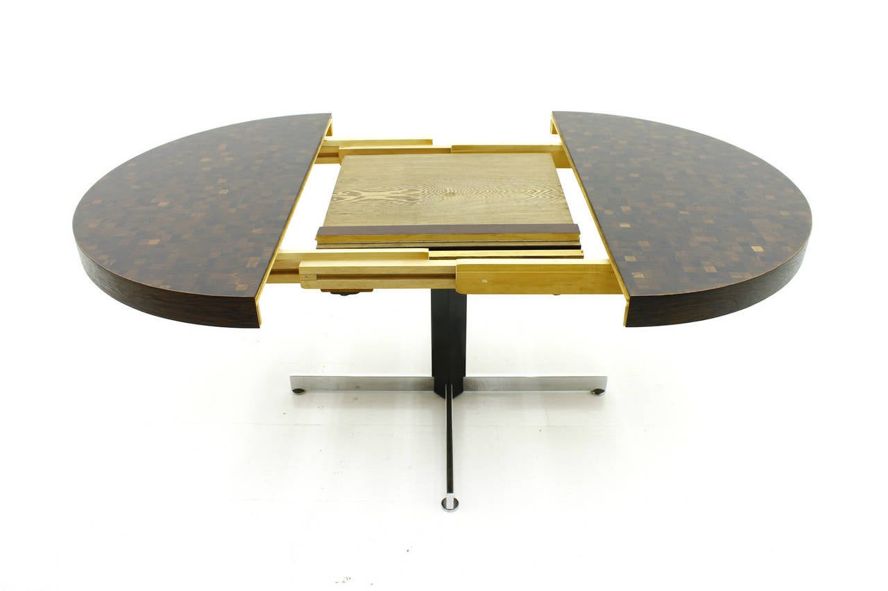 Heavy Dining Table by Dieter Wäckerlin for Idealheim, Switzerland, 1960`s
Solid Macassar, Iron and Metal.

Diameter 120 cm,  Maximun 184 cm, Height 74 cm.

very good Condition.

