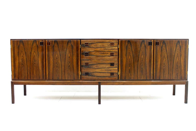 Beautiful Rosewood Sideboard from Bernhard Pedersen & Son, Denmark 1960´s.
6 Legs, 4 Drawers, four Doors, Brass Details.
W 235 cm, H 86 cm, D 55 cm.
Excellent Condition!

We offer worldwide shipping. Please contact us for a transport offer for