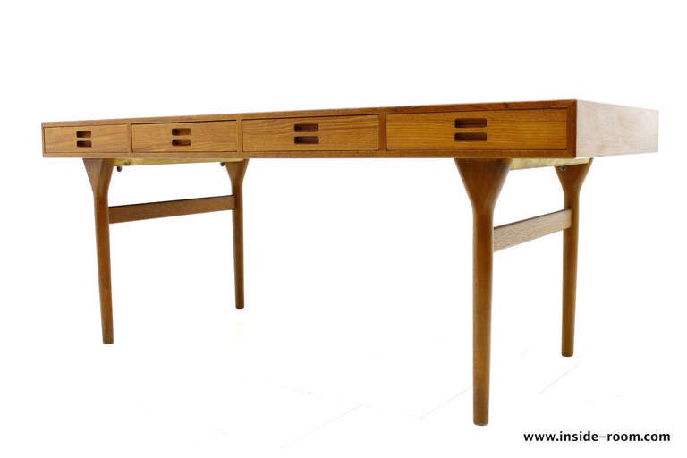Beautiful Freestanding Teak Desk by Nanna Ditzel, 1958 and Made by Søren Willadsen, Denmark. Most popular Version with four Drawers.

One of the Most Beautiful Danish Writing Desk.

Very good original Condition with small signs of use.