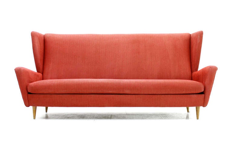 A lovely large Mid Century Sofa from the 50`s /60`s.
Nice Fabric in light red.
Good condition with small signs of usage.