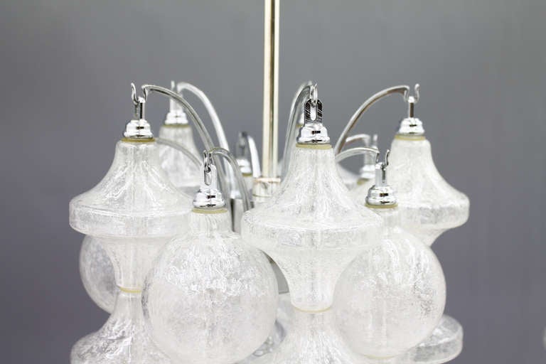 Four Italian Murano glass chandelier by Seguso, circa 1964.
30 glasses per chandelier.

Two chandelier with a long rod: Height 169 cm x diameter 26 cm.
Two chandelier with a short rod: Height 130 cm x diamater 26 cm.

Very good original