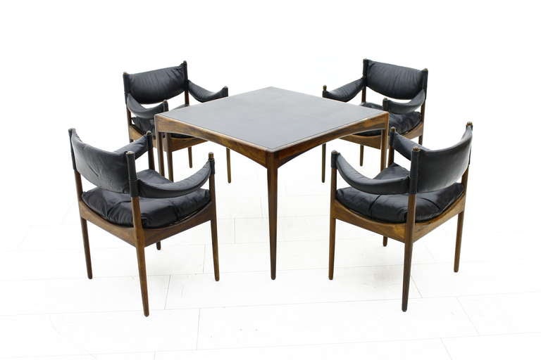 Rosewood / Leather dining / lounge Suite designed from Kristian Vedel and made by Soren Willardsen, Denmark. 
Four Dining Armchairs and a Dining Table, Leather and solid Rosewood. 

Dimensions Table: H 66 cm, W & D 90 cm, 
Dimensions Chairs: B