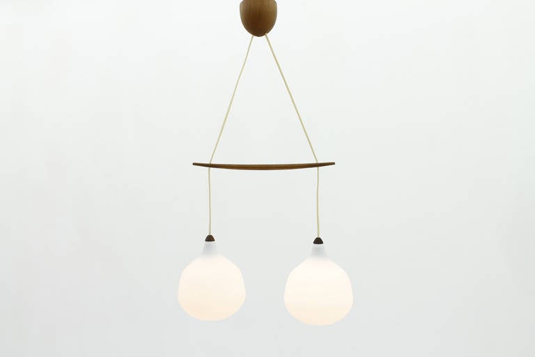 Glass and Teak Pendant by Uno & Osten Kristiansson for Luxus, Sweden, 1960s.

Very good condition.

 