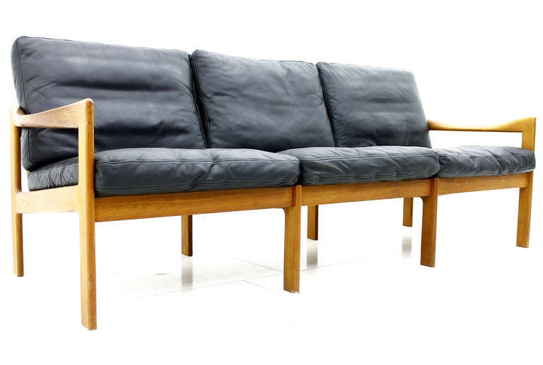 3 Seater Sofa by Illum Wikkelso, Denmark in Teak and Black Leather. The Cushions are with Down Filling. Very good Condition !

We offer worldwide shipping. Please contact us for a transport offer for a delivery to your door.