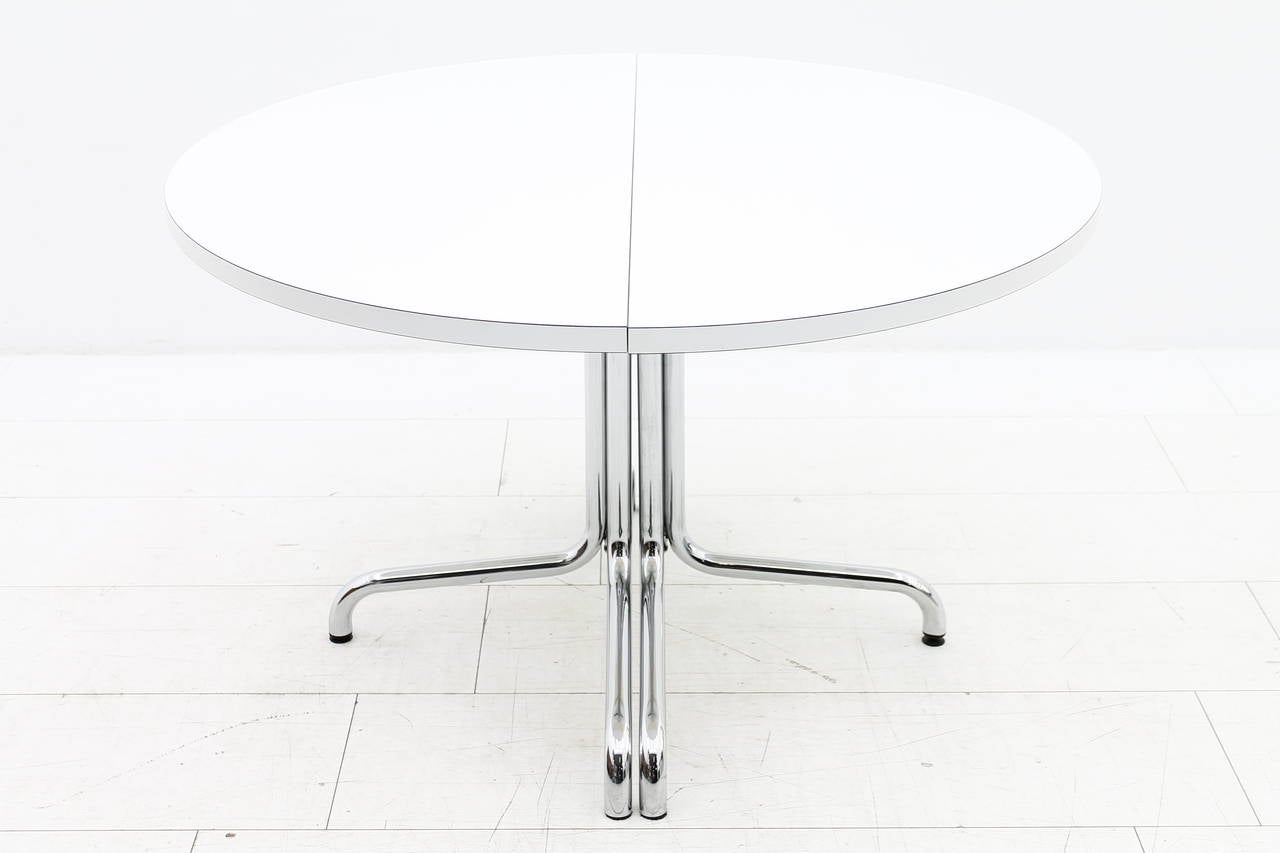 Dining table by Thonet, Germany Mod. 1052. Chromed steel, white laminate wood top.
Height 73 cm, Diameter 120cm, + 2 x 60 cm Extensions. Maximum wide 240.
Very good condition.