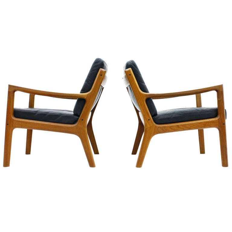 A Pair Leather and Teak Wood Lounge Chairs by Ole Wanscher, Denmark at