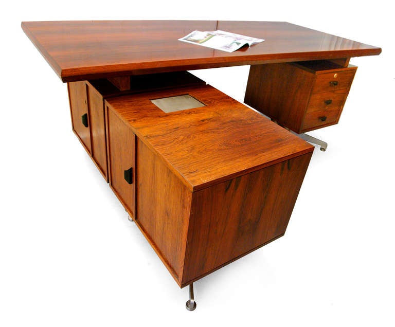 A remarkable midcentury modern desk made in Italy.
This inviting piece has a lot of features, such as the rollable large desktop, which can be push
forth and back as you need.
There is also comfortable a waste fold included.
Overall there are