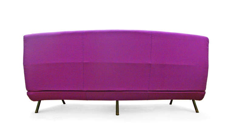 A fantastic curved triennale sofa by Marco Zanuso for Arflex | France, designed in 1951.
gently curved armless Design, supported by six angled metal legs and having three removable seat cushions with high back.
It has been newly upholstered in a
