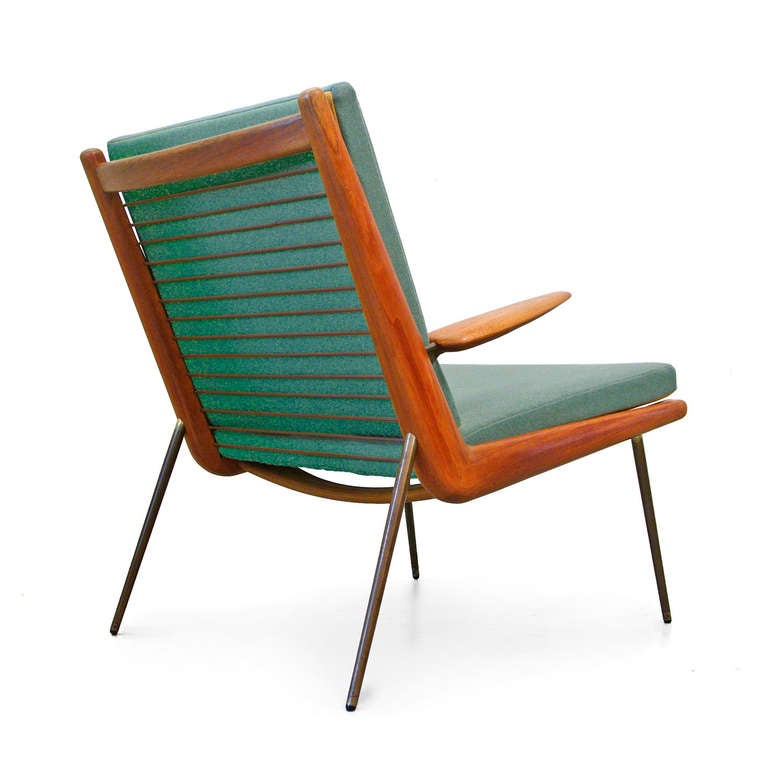 A gorgeous rare arm chair by the design duo Peter Hvidt & Orla M. Nielsen.
Produced by legendary manufacturer France & Daverkosen.
The frame is constructed of solid teak and the slim mess legs add an organic and soft feel design.
It is newly